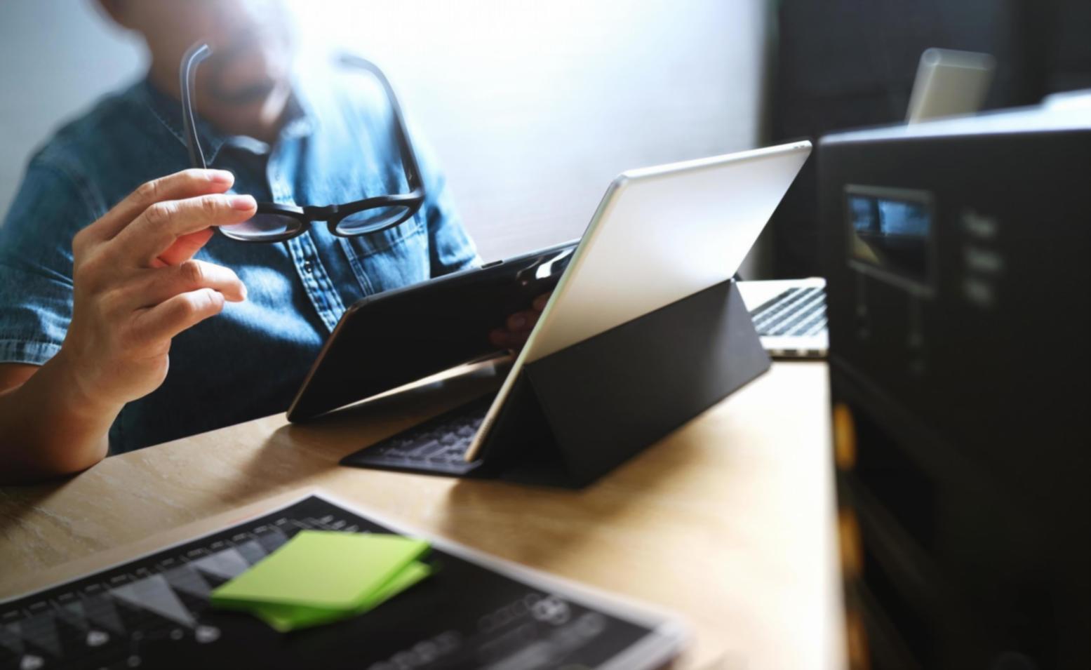 Student reviewing typography projects with detailed grid systems