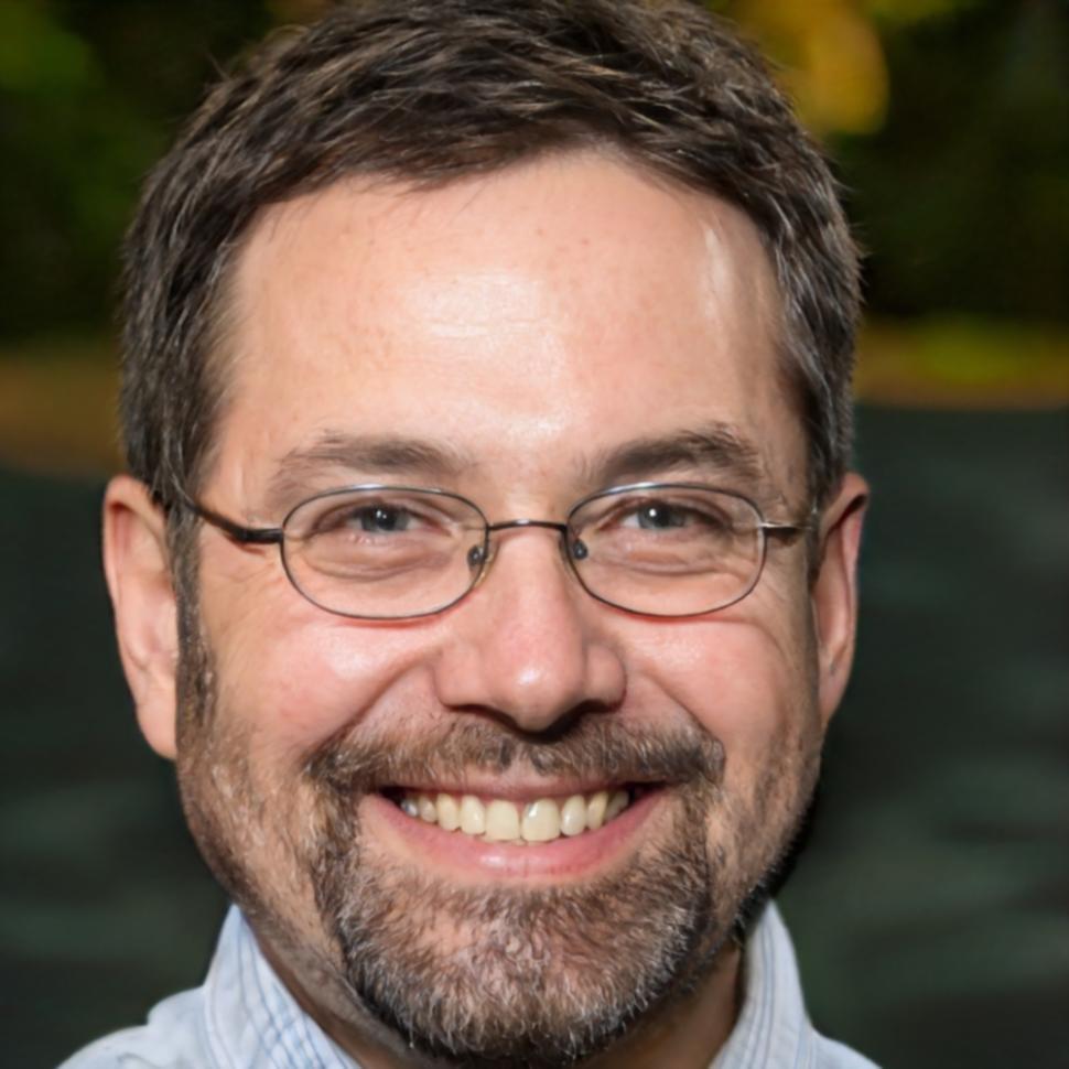 Senior typography instructor reviewing student work at desk